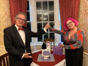 hubby and i with our alternative none wedding cake